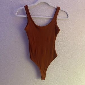 Orangish brown bodysuit